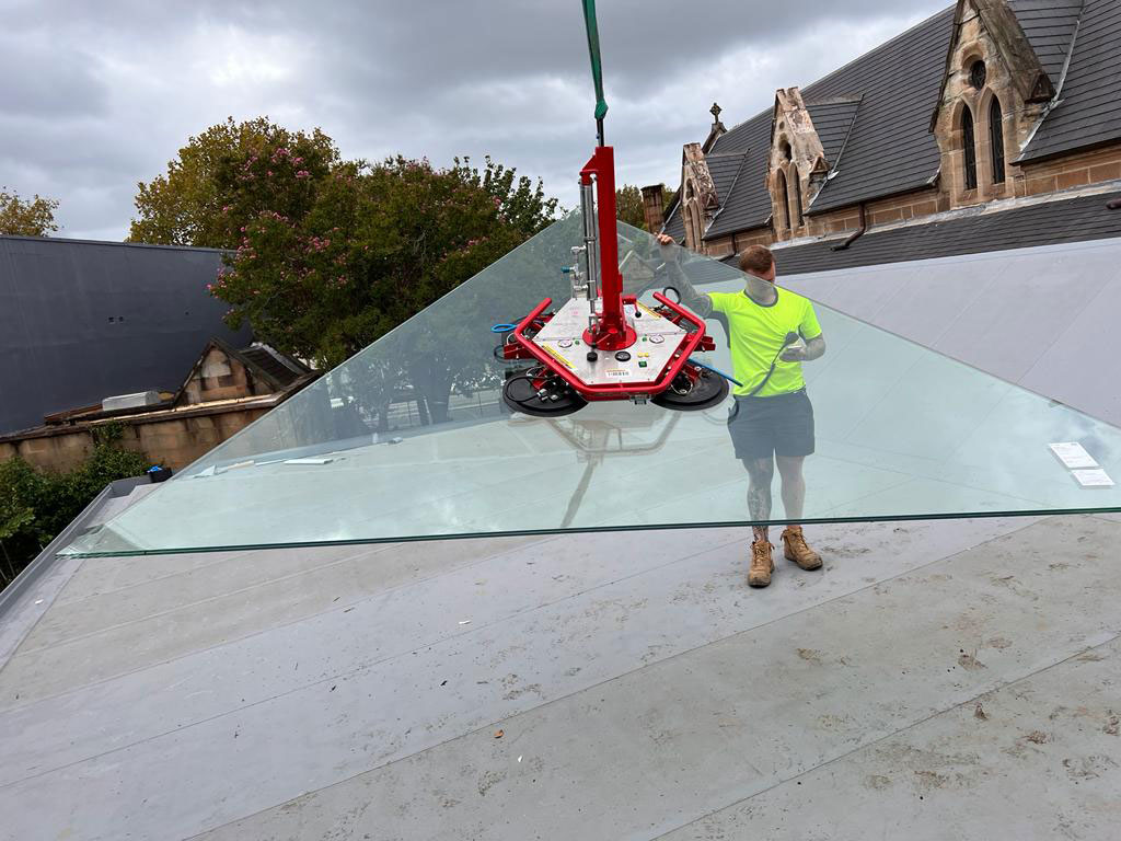 Custom-shaped fixed glass panels installed at Vine Church in Surry Hills